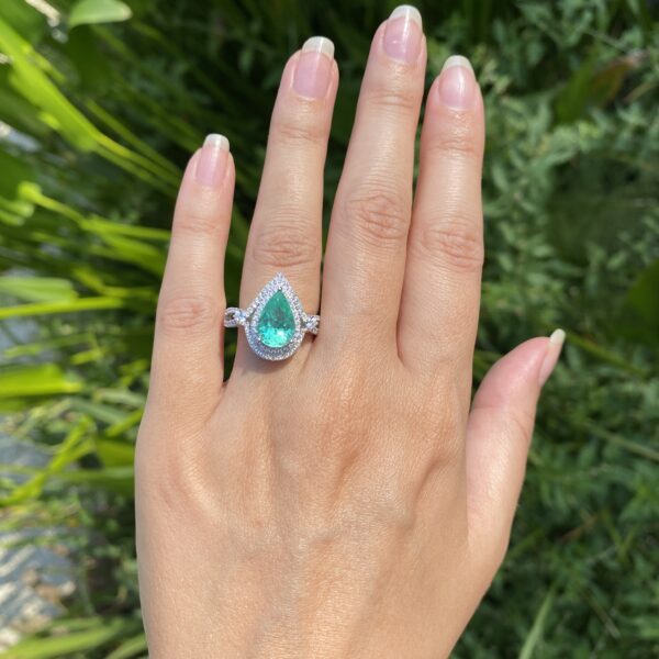 Pear-shaped emerald and diamond ring