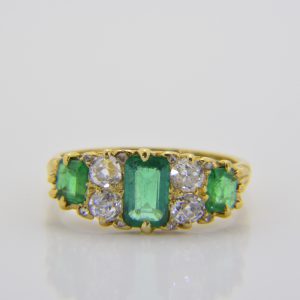 Emerald and diamond 7-stone ring