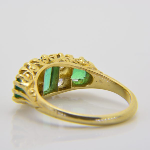 Emerald and diamond 7-stone ring