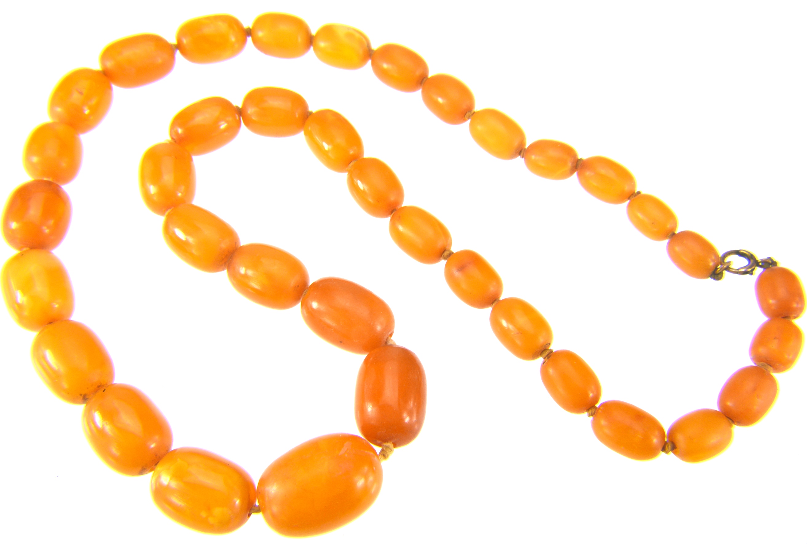 Lot 31 - Two amber bead necklaces, the first