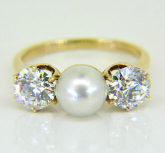 Pearl and diamond three-stone ring
